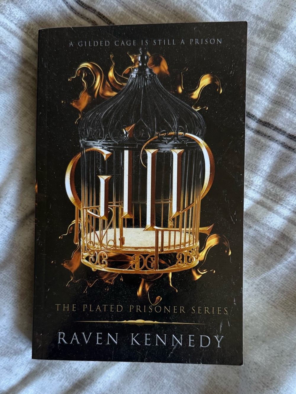 The Plated Prisoner (Raven Kennedy) – Black & Gold Paperback